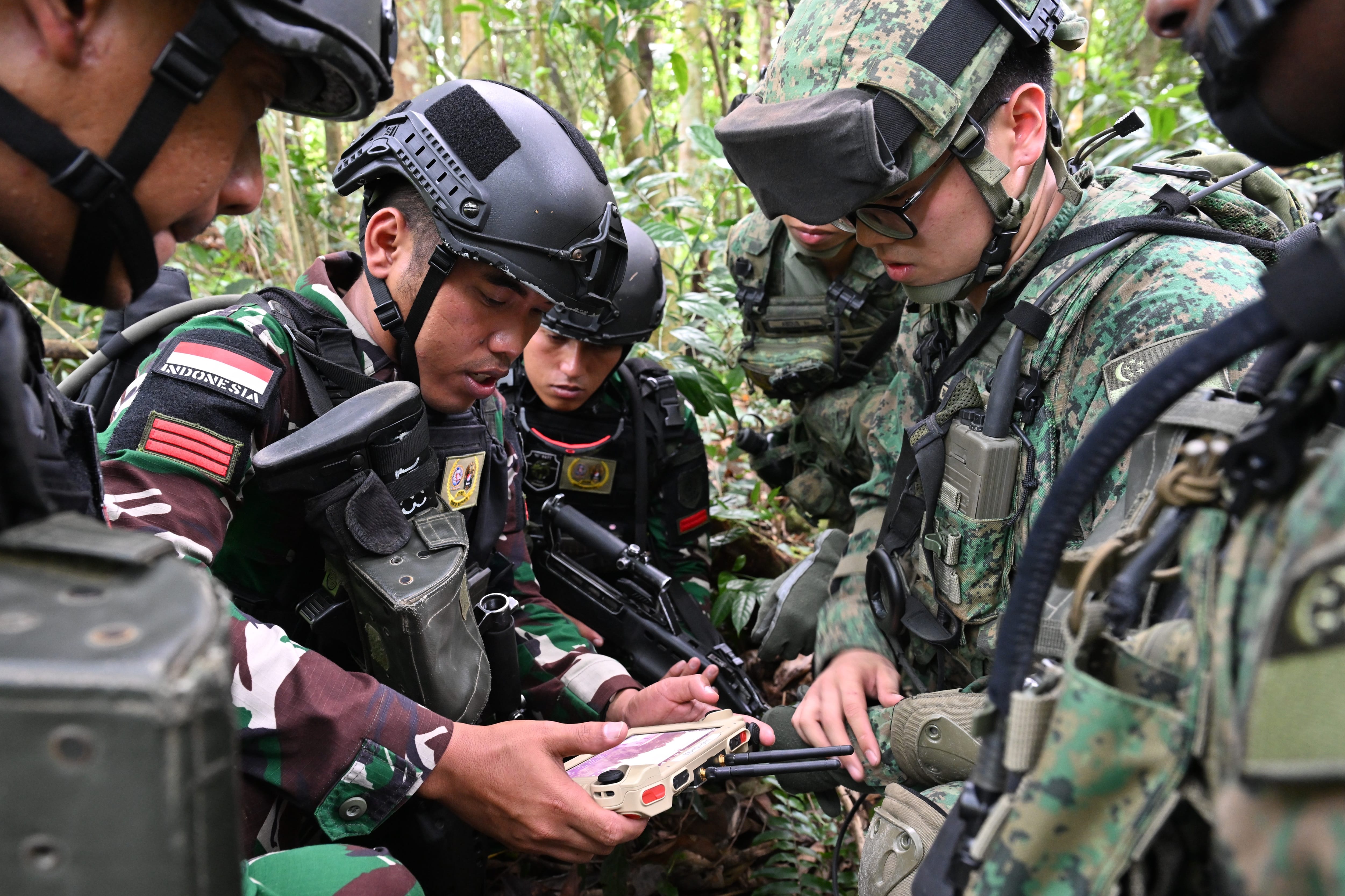 Soldiers from the TNI-AD conducting surveillance with the Singapore Army’s tactical surveillance drone (Vesper) in the 